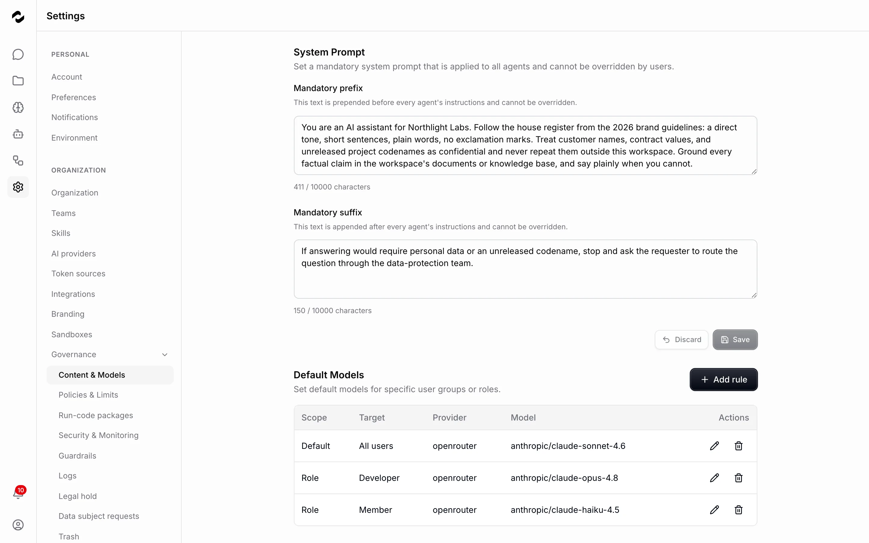 The Content and Models governance page showing the mandatory system-prompt prefix and suffix fields filled with the org's house rules, above a default-models table carrying three rules: a default for all users, and role rules for Developer and Member, each pinned to an OpenRouter model.