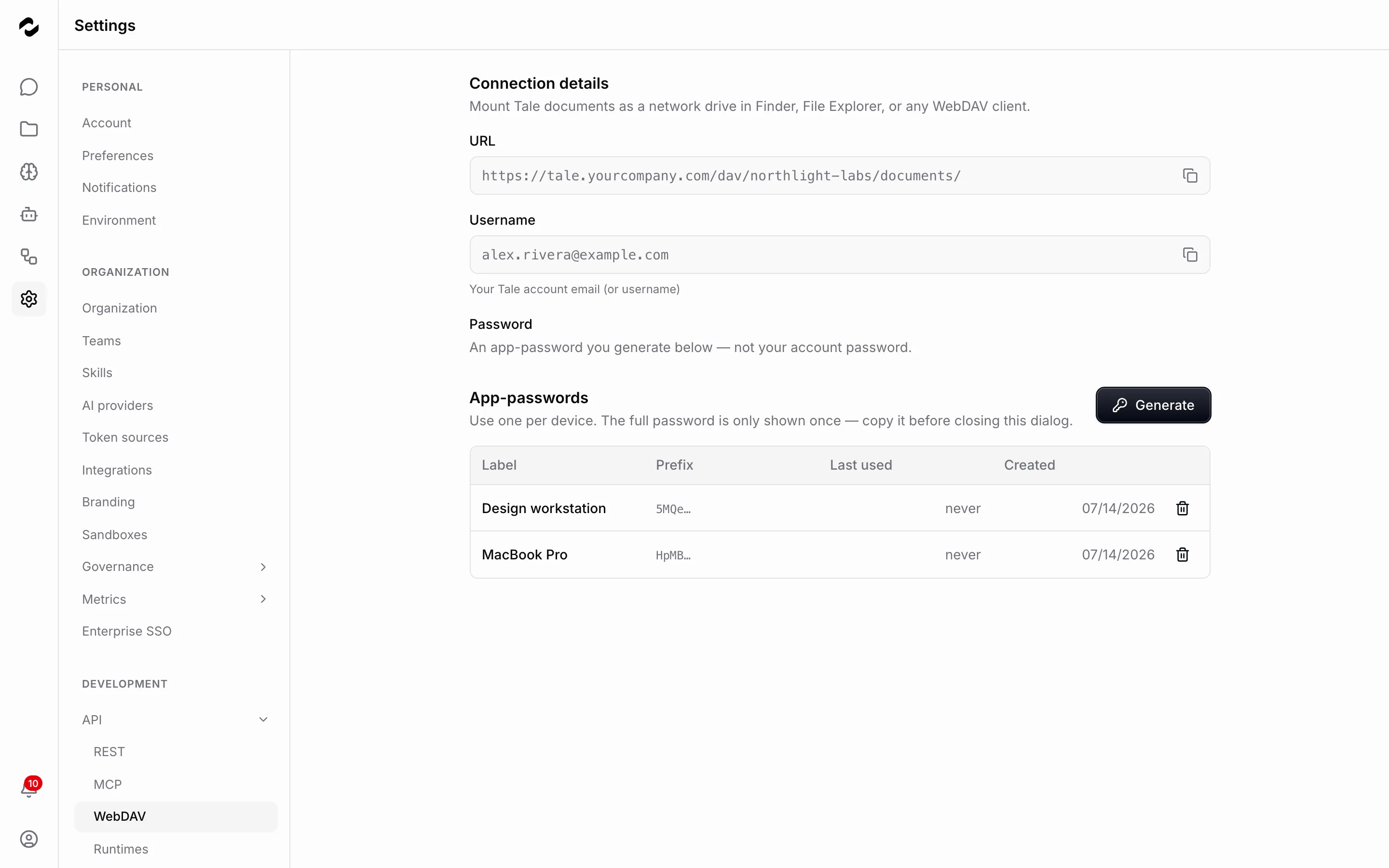 The WebDAV settings page showing a connection URL, a username field with the account email, an explanation that the password is a generated app-password, and an app-passwords table holding two entries — Design workstation and MacBook Pro, each with only its prefix and creation date — beside a Generate button.